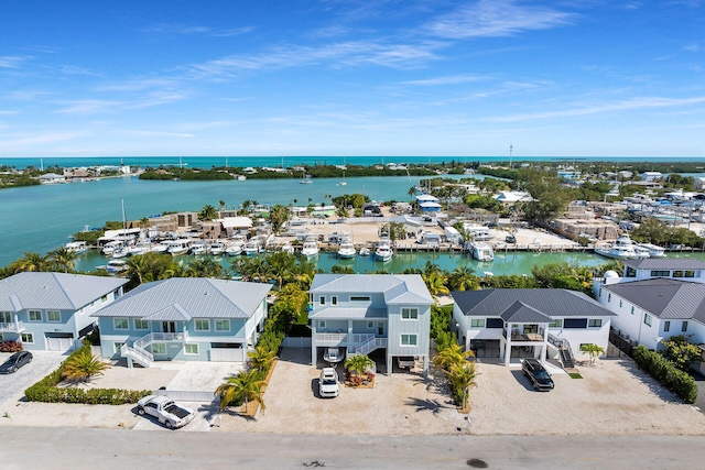 bird's eye view with a water view and a residential view