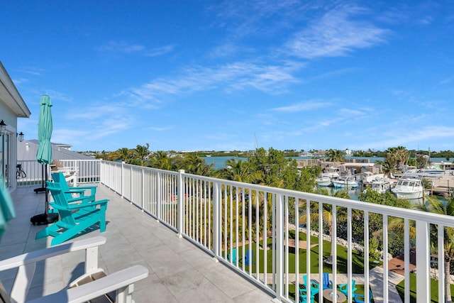 balcony featuring a water view