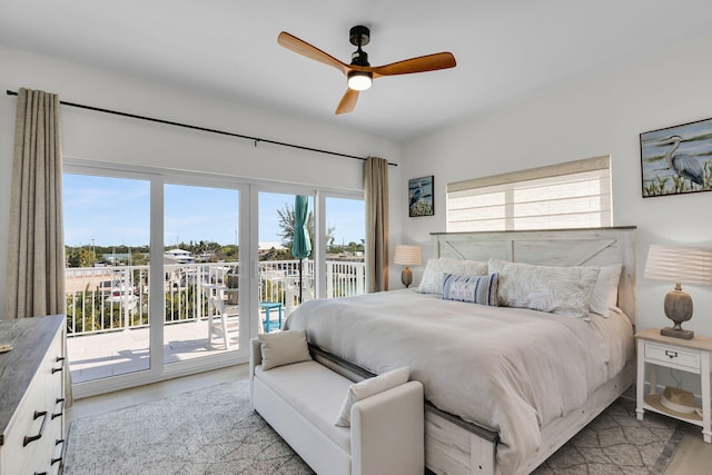 bedroom featuring light wood-style floors, access to exterior, and ceiling fan