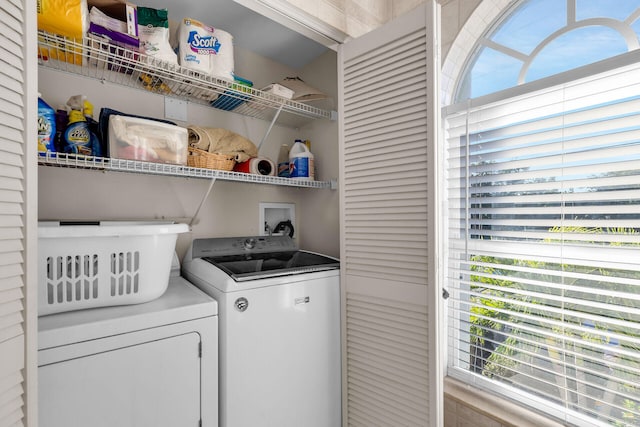 washroom with laundry area and independent washer and dryer