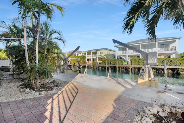 exterior space featuring a water view and a boat dock