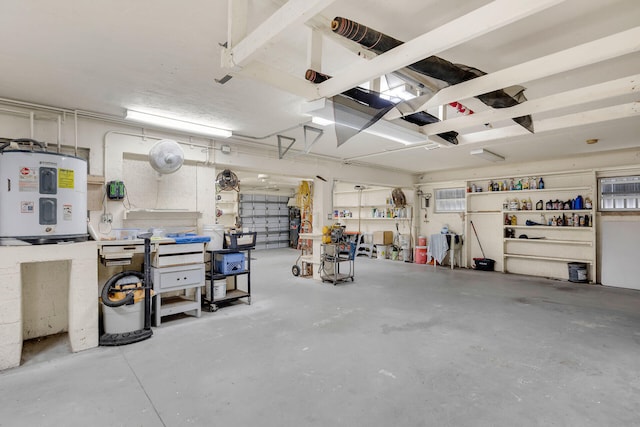 garage featuring water heater and a workshop area