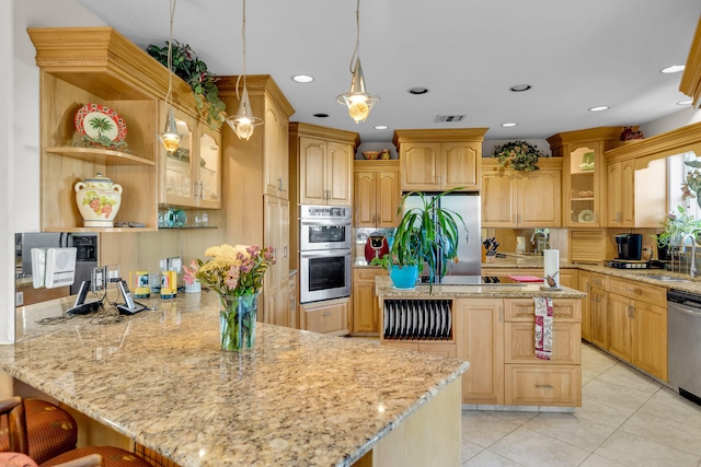 kitchen featuring stainless steel appliances, a kitchen breakfast bar, hanging light fixtures, open shelves, and glass insert cabinets