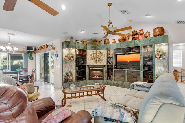 living area featuring lofted ceiling, light tile patterned floors, and visible vents