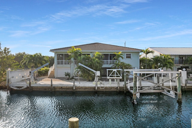 view of dock featuring a water view and boat lift