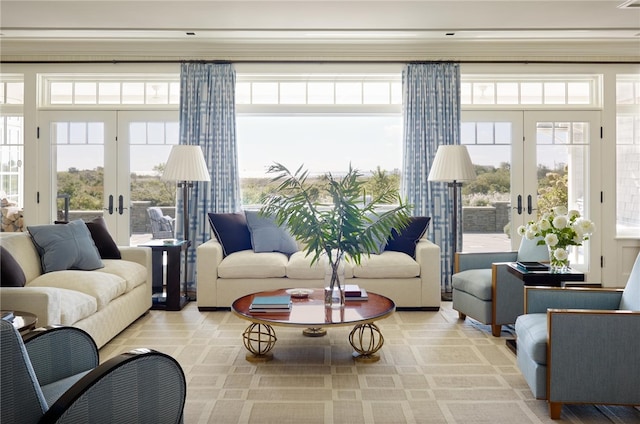 sunroom / solarium featuring french doors