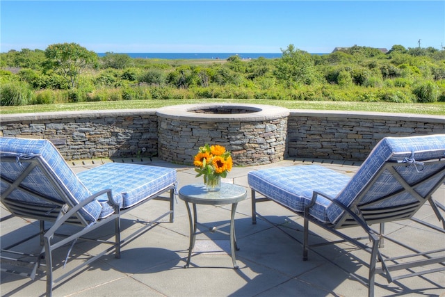 view of patio / terrace with an outdoor fire pit