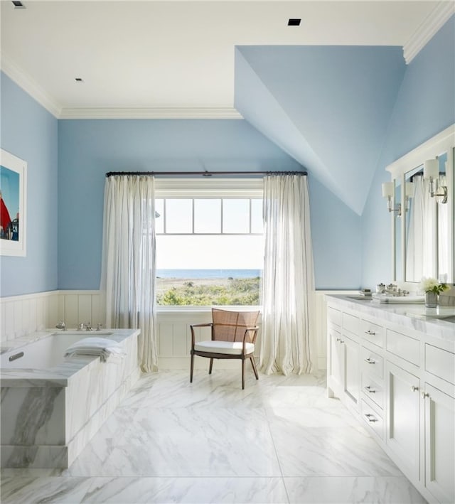 bathroom featuring vanity, ornamental molding, a tub, and vaulted ceiling