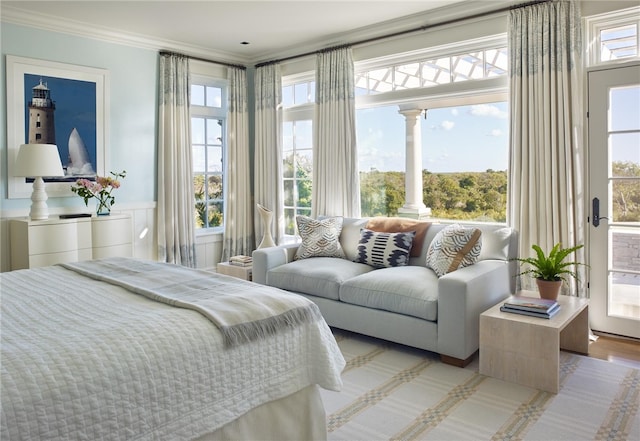 bedroom with light hardwood / wood-style floors and crown molding