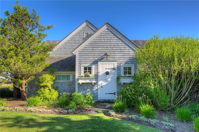 rear view of house with a lawn