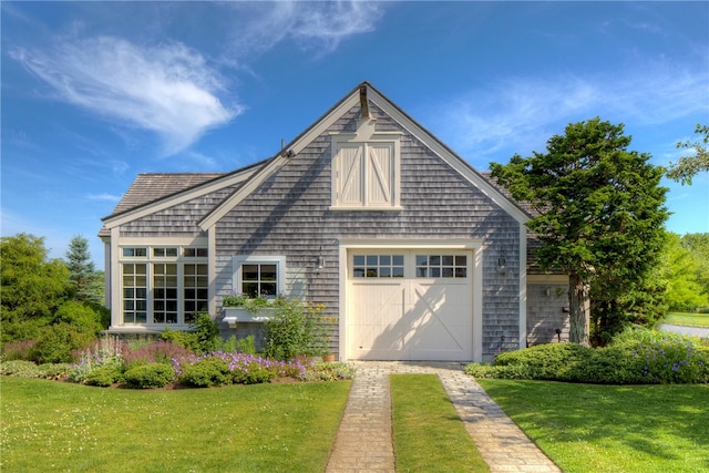 exterior space with a front yard and a garage