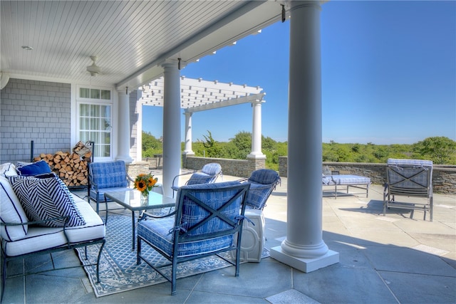 view of patio featuring an outdoor hangout area and a pergola