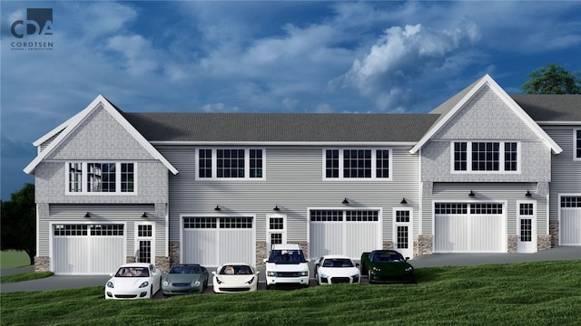 exterior space featuring a front lawn and a garage