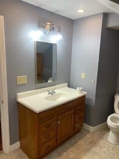 bathroom with tile patterned floors, toilet, and vanity