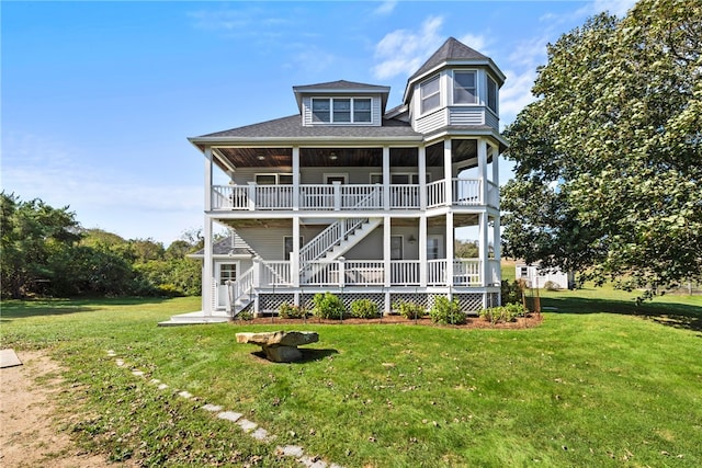 back of house featuring a lawn