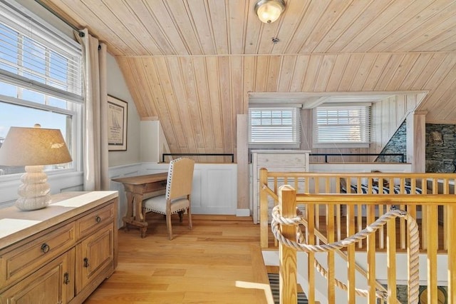 interior space featuring lofted ceiling, light hardwood / wood-style flooring, and wooden ceiling