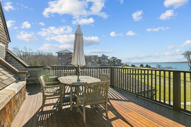 wooden terrace with a water view