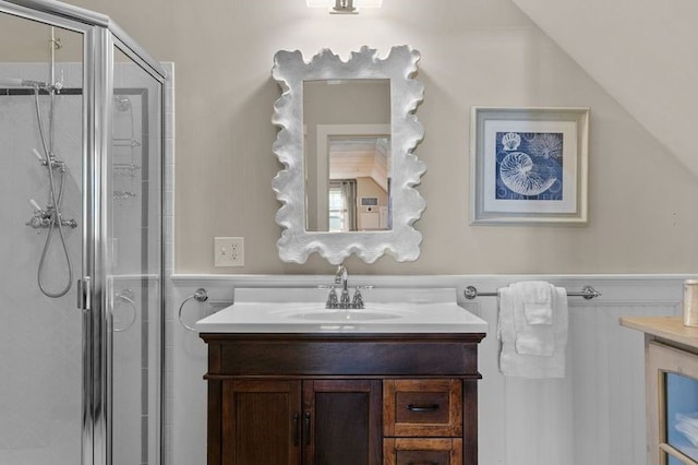 bathroom with vanity and a shower with door