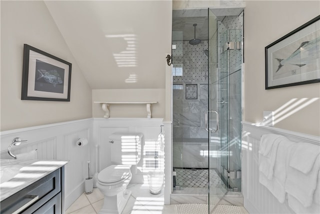 bathroom with a shower with shower door, vanity, tile patterned flooring, toilet, and lofted ceiling