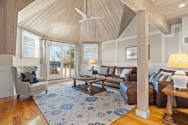 living room featuring wood-type flooring, a wealth of natural light, and wood ceiling