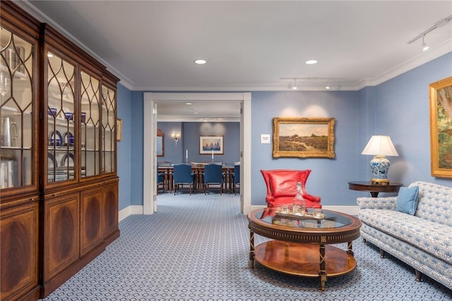 living room with crown molding and carpet