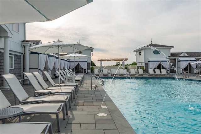 view of pool with pool water feature and a patio area