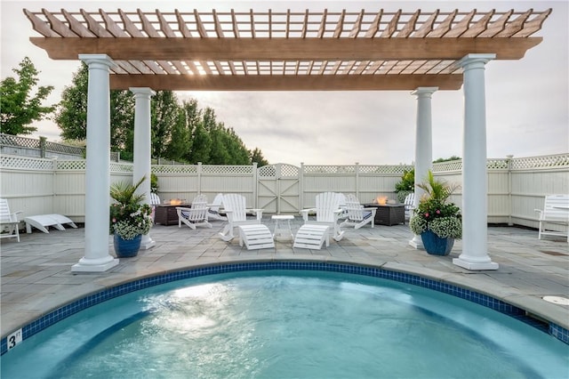 view of swimming pool with a patio area and a pergola