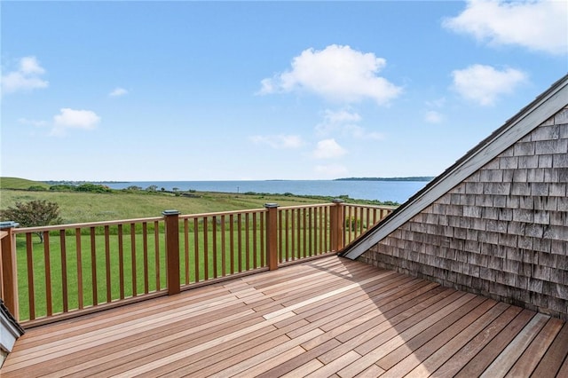 wooden deck featuring a water view and a yard