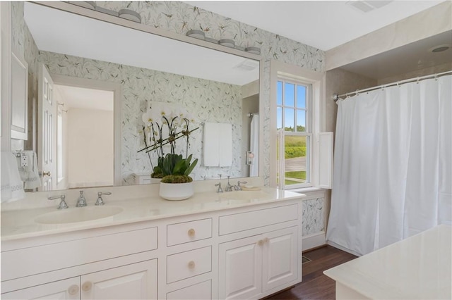 bathroom featuring vanity and hardwood / wood-style flooring