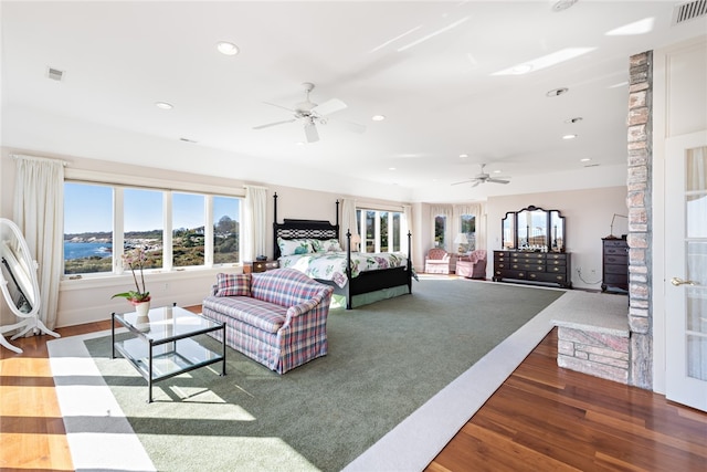 living room featuring carpet flooring and ceiling fan