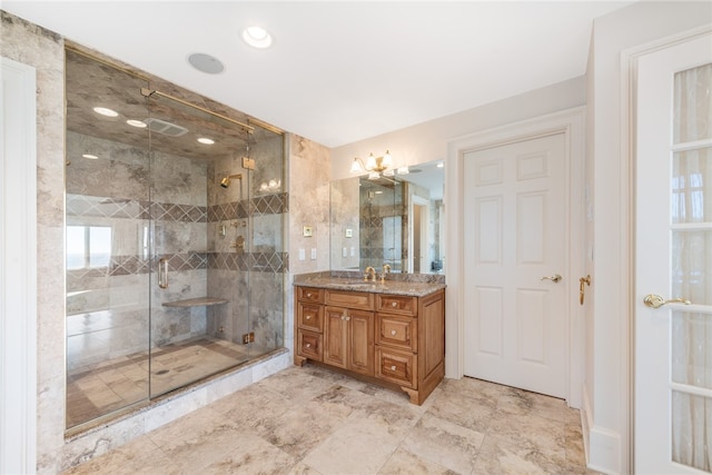 bathroom with walk in shower, large vanity, and tile floors