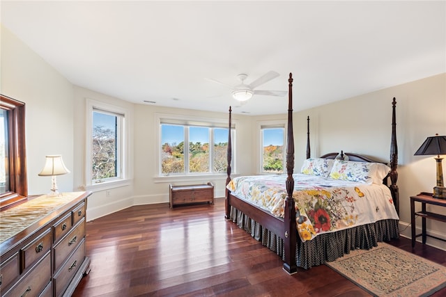 bedroom with ceiling fan and dark hardwood / wood-style flooring