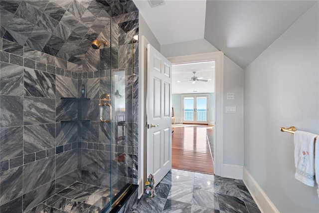 bathroom featuring a shower with door, tile flooring, ceiling fan, and lofted ceiling