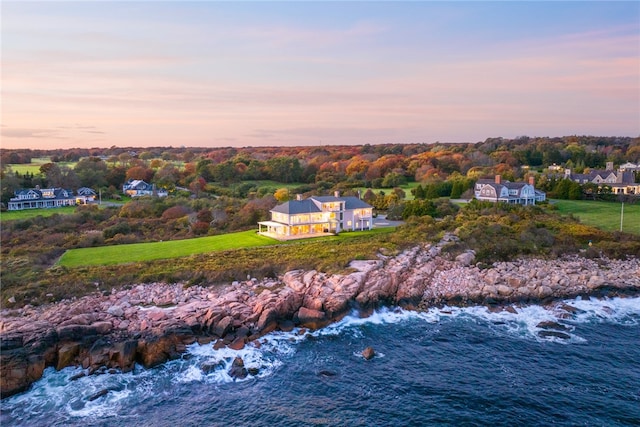 aerial view at dusk with a water view