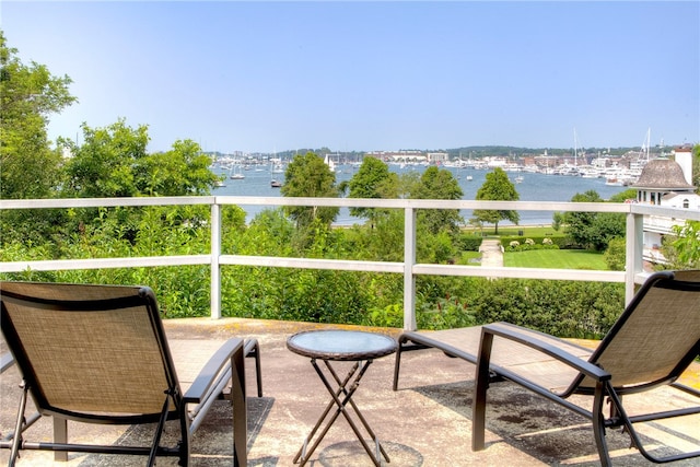 balcony featuring a water view