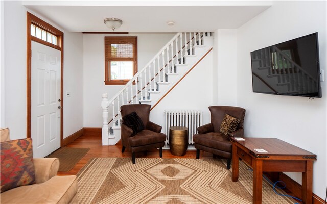 entryway featuring radiator heating unit and hardwood / wood-style floors