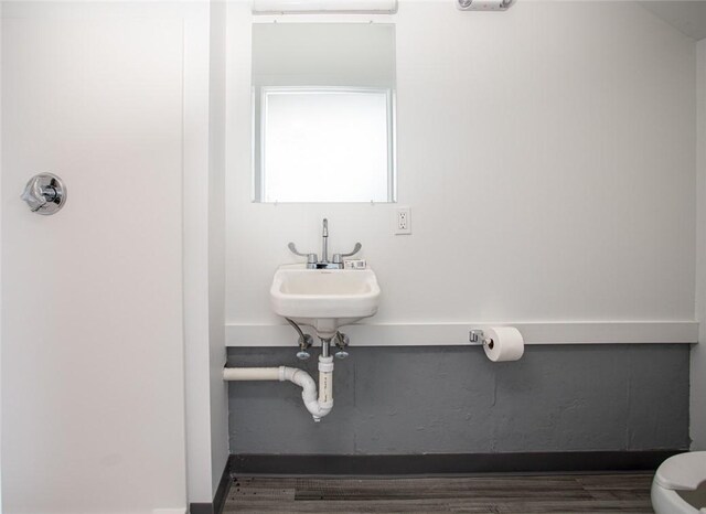55 John Clarke Rd Unit 3, Middletown, RI 02842 - bathroom with toilet and wood finished floors