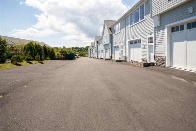 55 John Clarke Rd Unit 3, Middletown, RI 02842 - view of asphalt road with a residential view