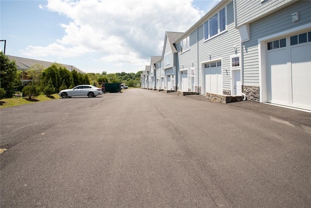 55 John Clarke Rd Unit 3, Middletown, RI 02842 - view of asphalt street featuring a residential view
