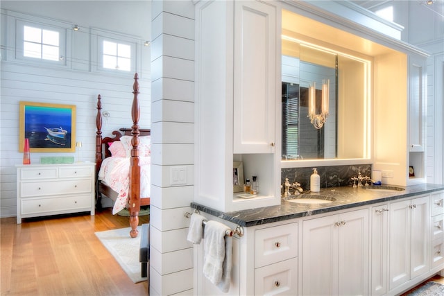 bathroom with vanity and hardwood / wood-style floors