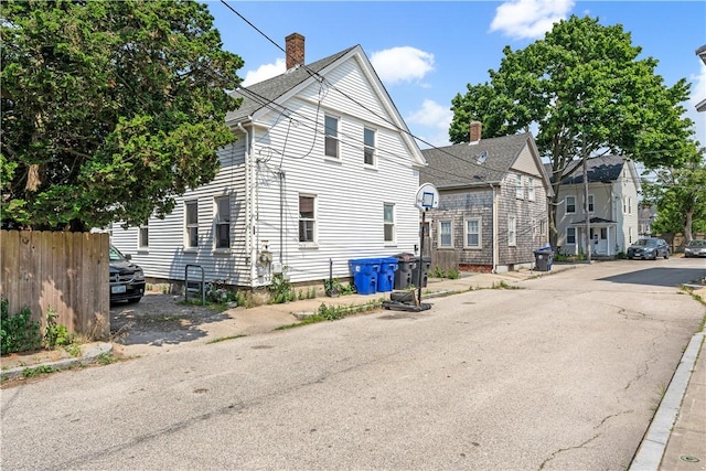 view of front of property featuring fence