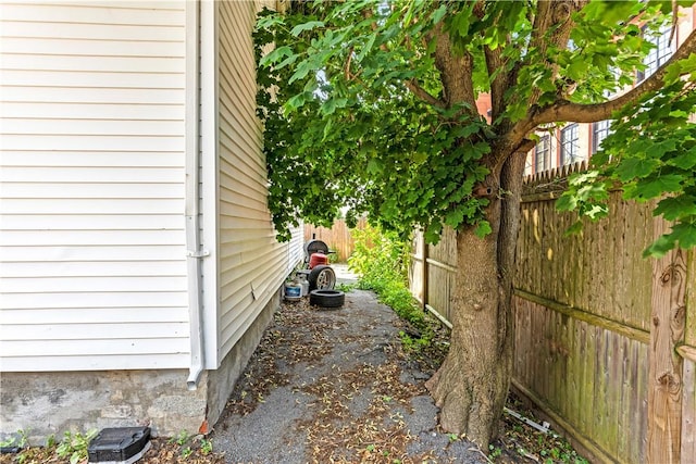 view of home's exterior featuring fence