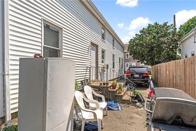 view of side of property with fence