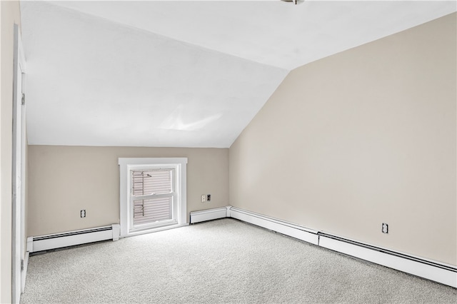 bonus room with vaulted ceiling, light colored carpet, and a baseboard radiator