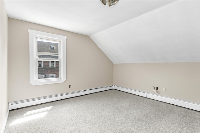 bonus room featuring carpet floors and vaulted ceiling