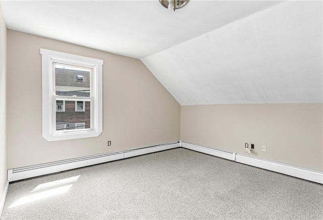 additional living space with lofted ceiling, carpet, and a baseboard radiator