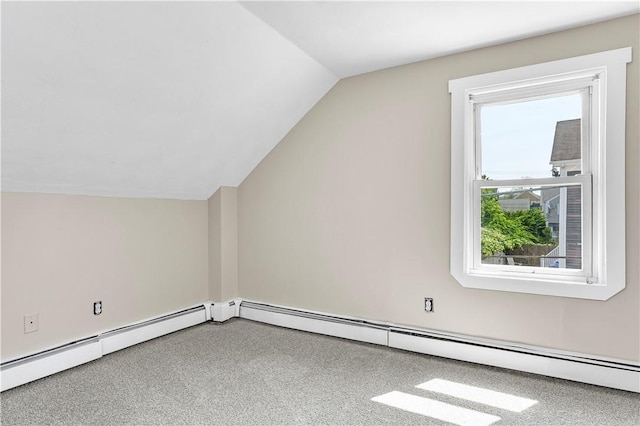 bonus room featuring a baseboard heating unit, vaulted ceiling, and carpet flooring