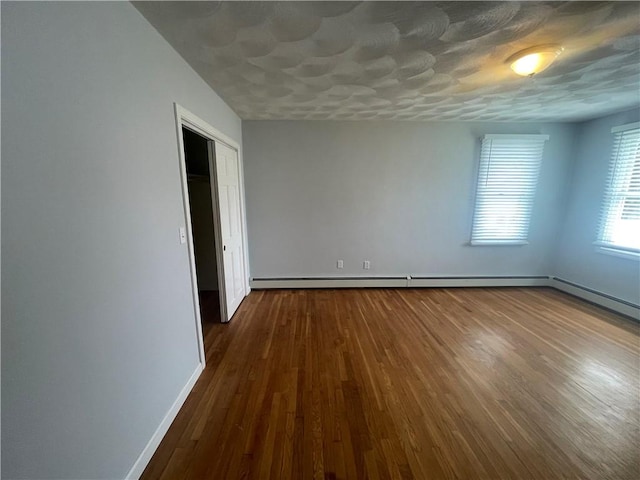 spare room with dark wood-type flooring