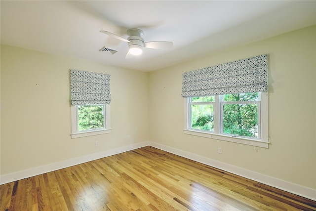 spare room featuring ceiling fan and light hardwood / wood-style floors