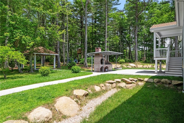 view of yard featuring a gazebo and a patio